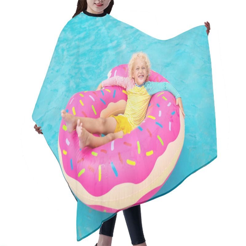 Personality  Child In Swimming Pool On Funny Inflatable Donut Float Ring. Little Boy Learning To Swim In Outdoor Pool Of Tropical Resort. Water Toys For Kids. Healthy Sport Activity For Children. Sun Protection.  Hair Cutting Cape