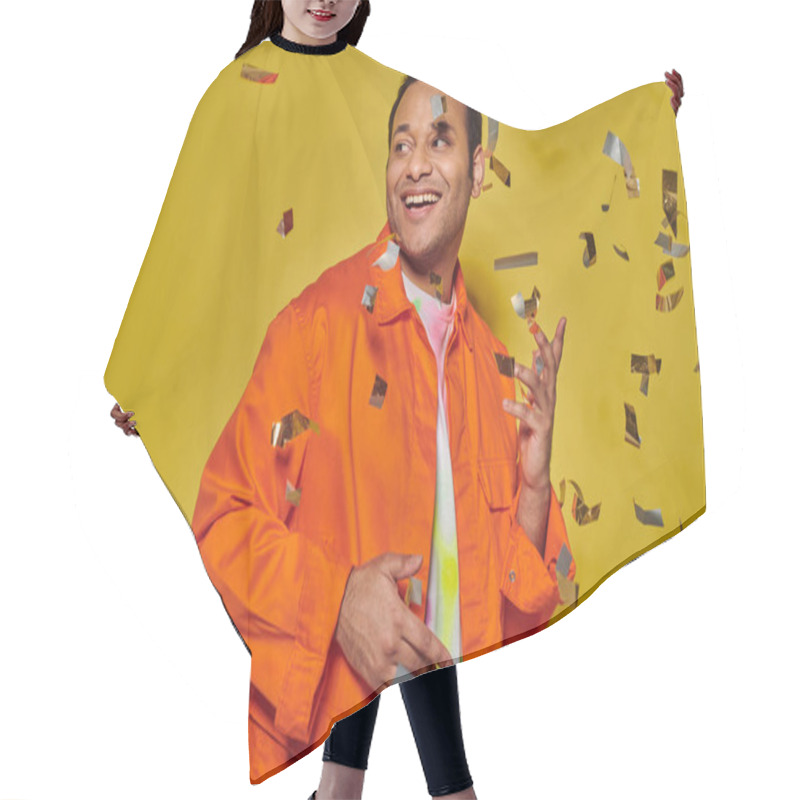 Personality  Happy Indian Man In Bright Orange Jacket Smiling Near Falling Confetti On Yellow Backdrop, Party Hair Cutting Cape