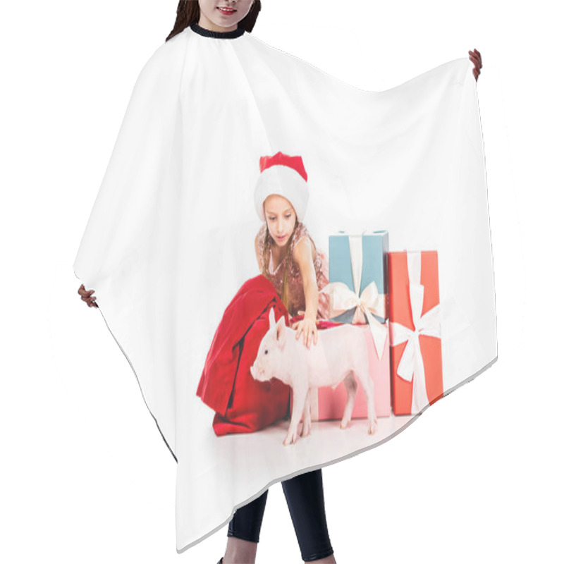 Personality  Cute Happy Child In Santa Hat Stroking Pig And Sitting Near Christmas Presents Isolated On White Hair Cutting Cape