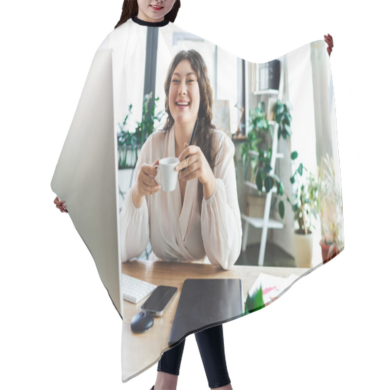 Personality  A Cheerful Young Woman Sips Coffee At Her Desk, Embracing The Comfort Of Her Office. Hair Cutting Cape