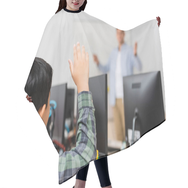 Personality  Selective Focus Of Schoolboy With Raised Hand Sitting Near Robot And Computers During Lesson In Stem School Hair Cutting Cape