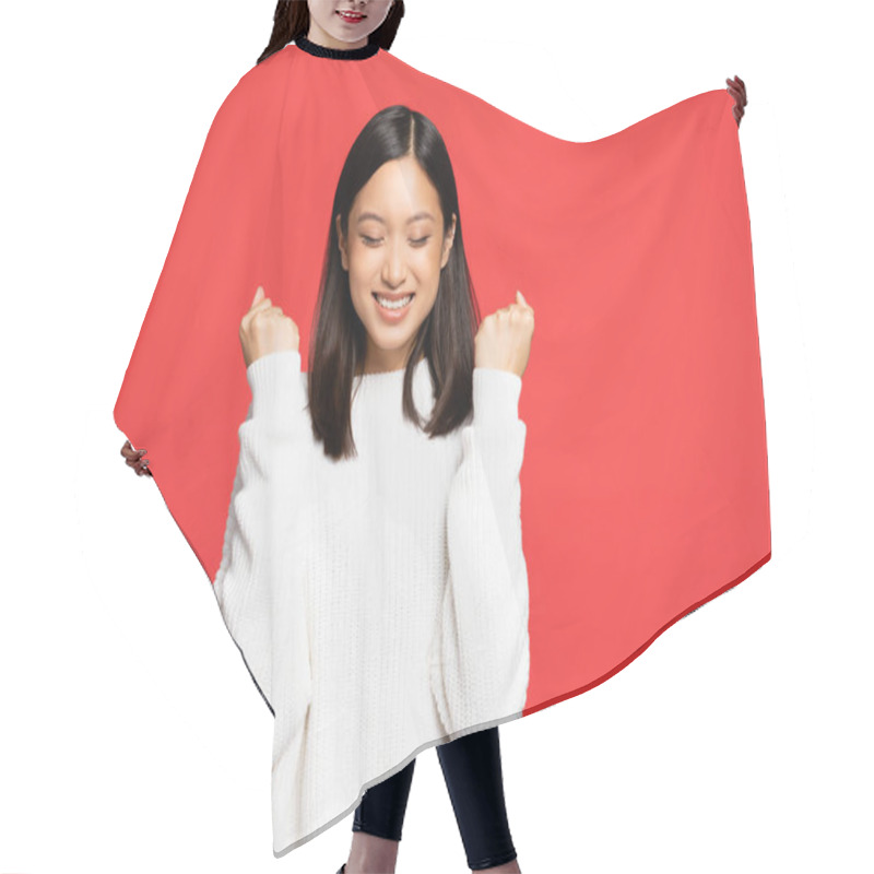 Personality  Young Asian Woman With Closed Eyes Rejoicing And Smiling Isolated On Red  Hair Cutting Cape