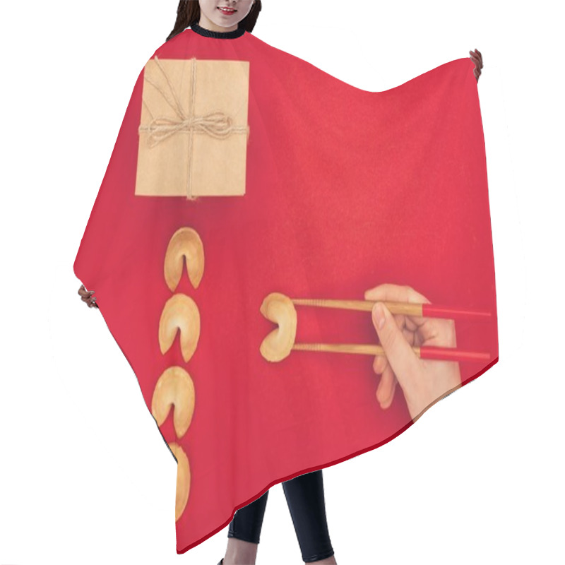 Personality  Cropped Shot Of Woman Taking Chinese Fortune Cookie With Chopsticks, Chinese New Year Concept Hair Cutting Cape