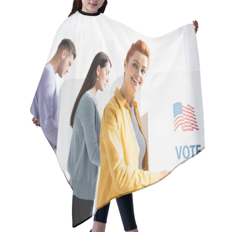 Personality  Smiling Woman Pointing With Pen On American Flag And Vote Inscription On Polling Booth On Blurred Background Hair Cutting Cape