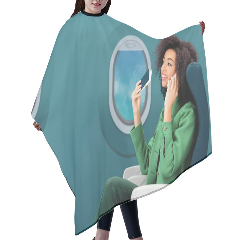 Personality  Smiling African American Woman Talking On Smartphone And Holding Passport With Air Ticket On Green Background With Portholes Hair Cutting Cape