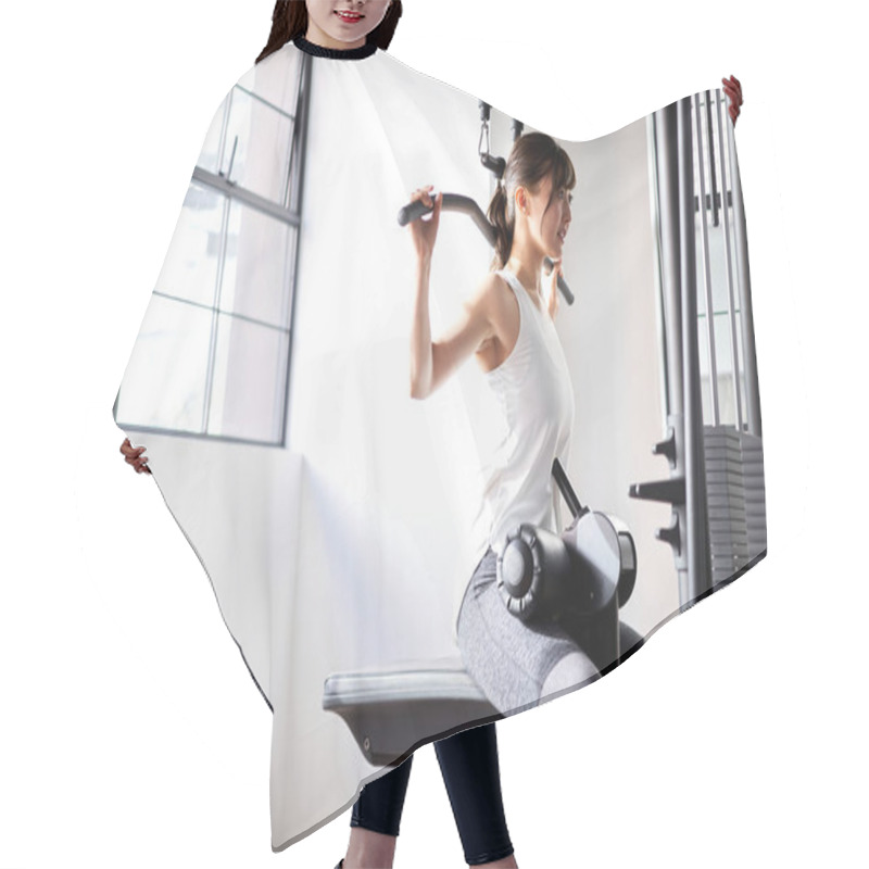 Personality  Asian Woman Doing Back Lat Pull-down In Training Gym Hair Cutting Cape