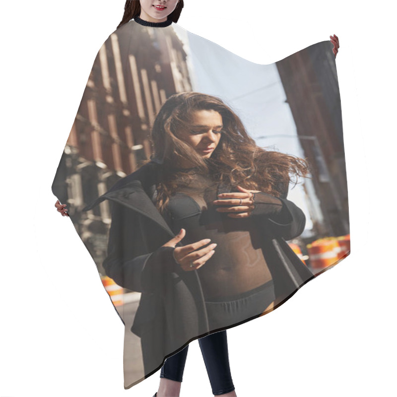 Personality  Silhouetted Against NYC Buildings, A Young Woman Dances In The Street. Hair Cutting Cape