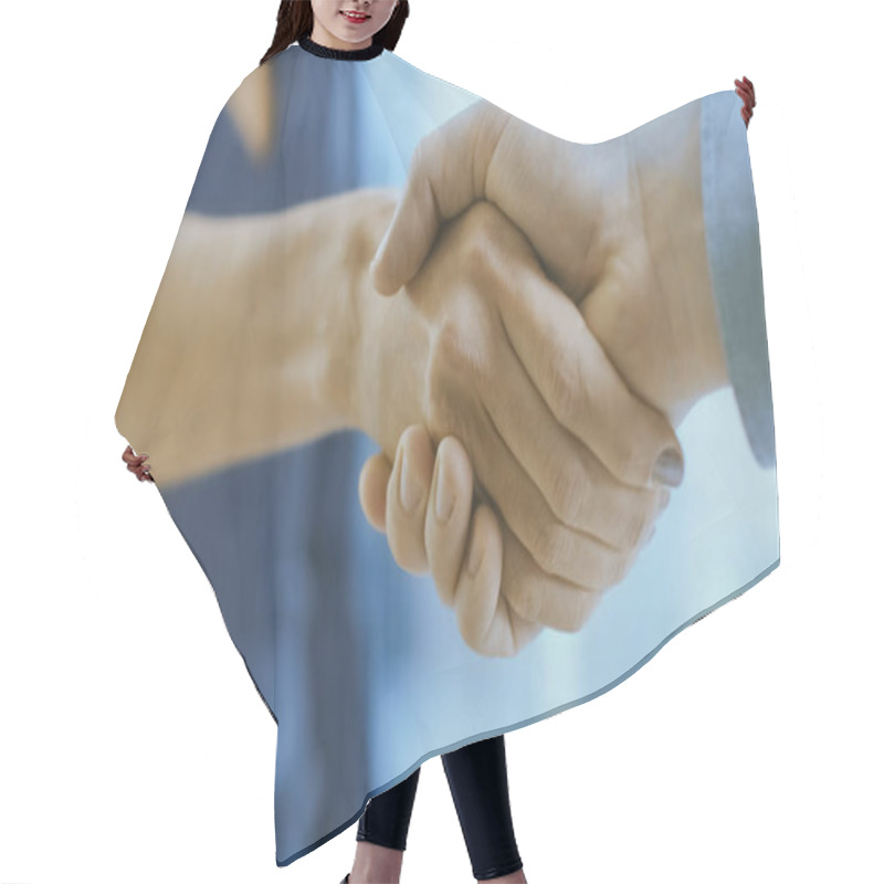 Personality  Out Of Focus Businesswoman Shakes Her Hand With A Businessman. Hands In Focus. Finalizing The Deal And Concluding Contract With A Handshake. Hair Cutting Cape