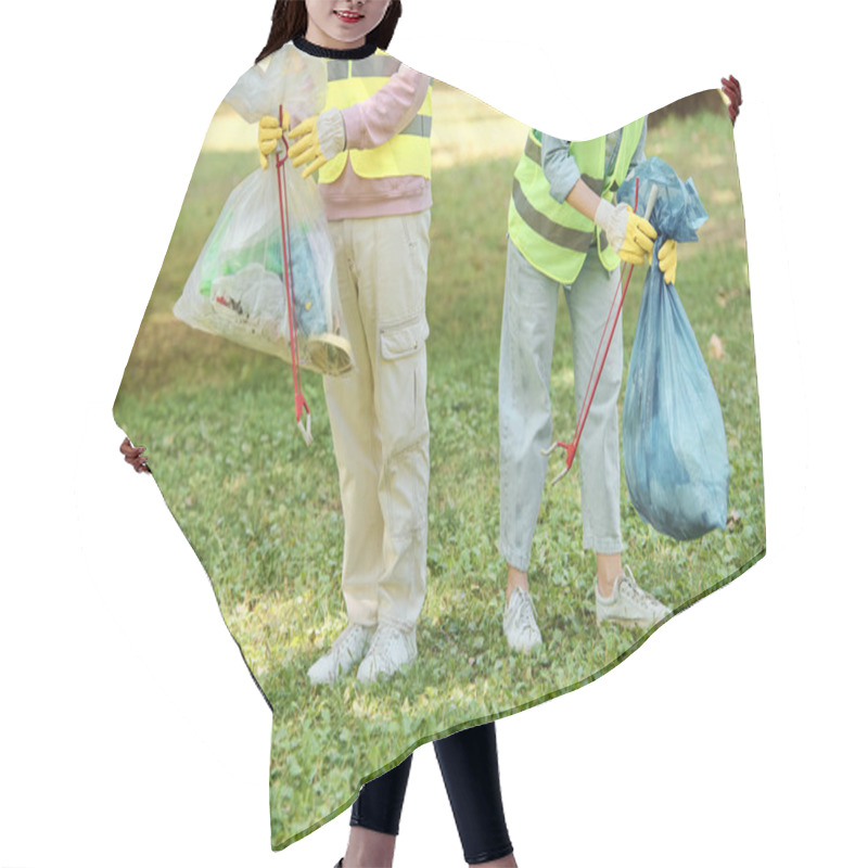 Personality  A Socially Active, Diverse Couple In Safety Vests And Gloves Cleaning A Park Together, Standing In The Lush Green Grass. Hair Cutting Cape