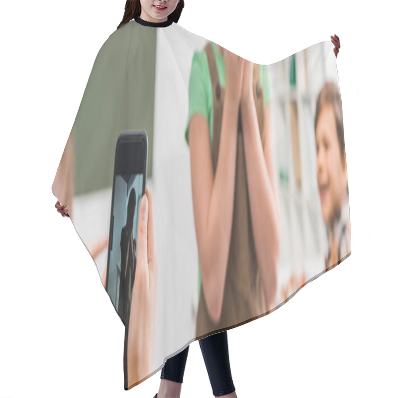 Personality  Panoramic Shot Of Schoolgirl Taking Photo Of Classmate, Cyberbullying Concept  Hair Cutting Cape