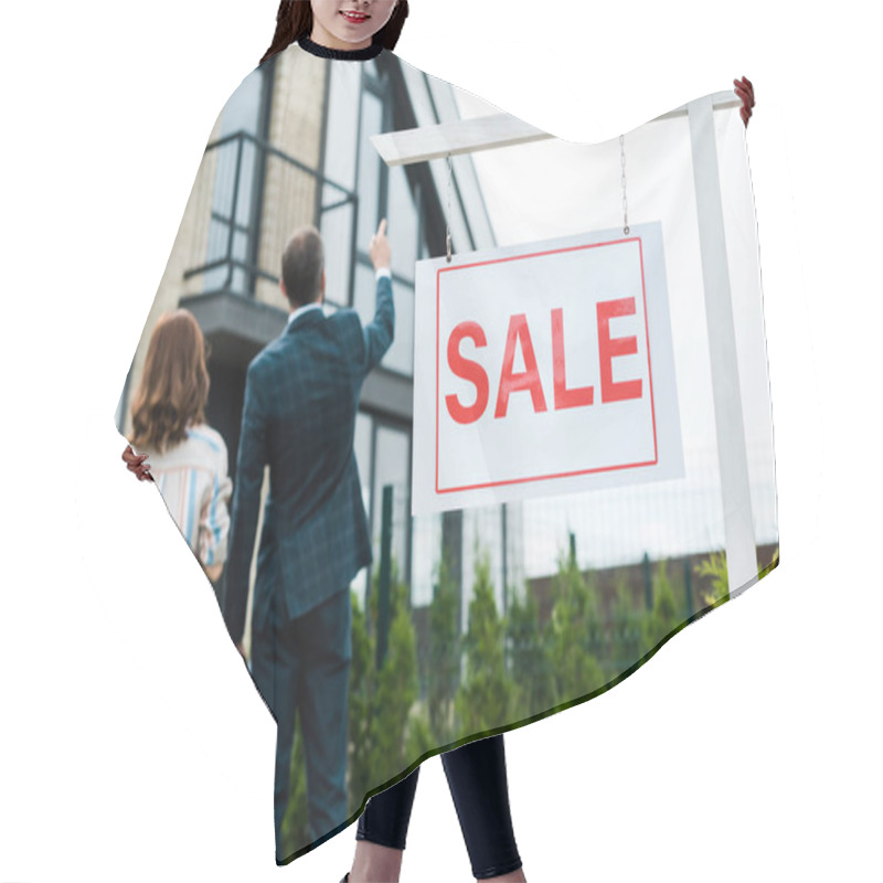 Personality  Back View Of Broker Pointing With Finger At House While Standing Near Woman  Hair Cutting Cape