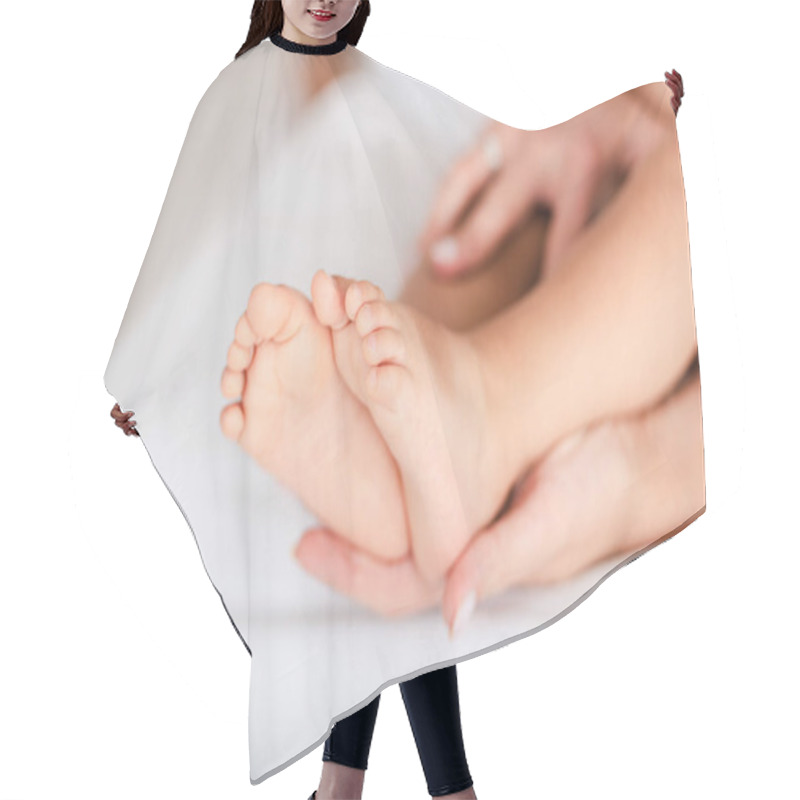 Personality  Cropped View Of Woman Touching Legs Of Baby Daughter Hair Cutting Cape