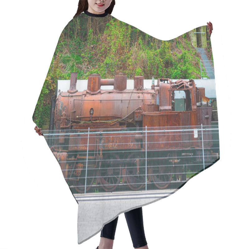 Personality  An Old Steam Locomotive, Covered In Rust, Stands Behind A Metal Fence Surrounded By Lush, Overgrown Vegetation. The Scene Evokes Nostalgia And The Heritage Of The Industrial Era. Hair Cutting Cape