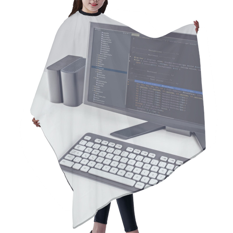 Personality  Web Site Codes On Computer Monitor On Office Desktop Hair Cutting Cape