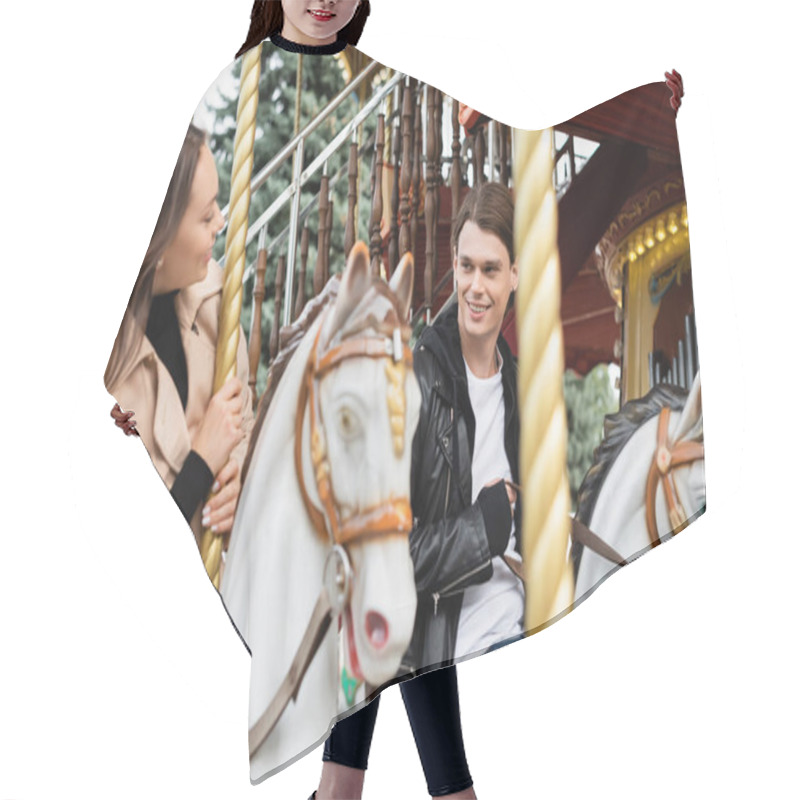 Personality  Cheerful Young Man Looking At Girlfriend Riding Carousel Horse In Amusement Park Hair Cutting Cape