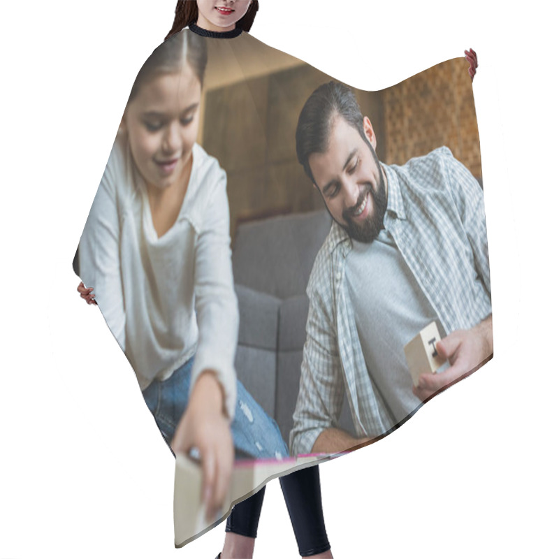 Personality  Cheerful Father With Daughter Making Words By Cubes With Letters At Home  Hair Cutting Cape