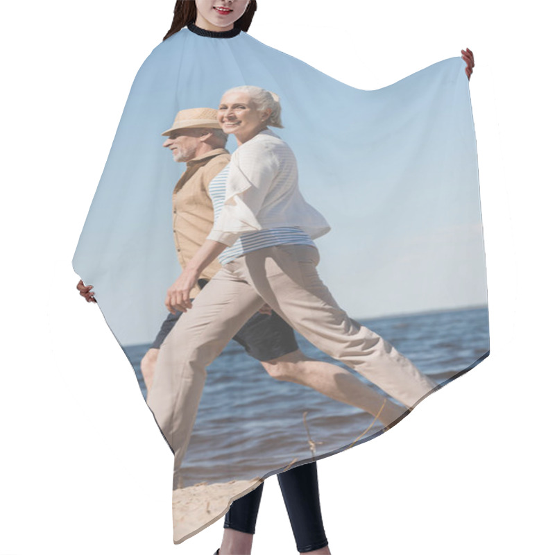 Personality  Senior Couple Walking On Beach  Hair Cutting Cape