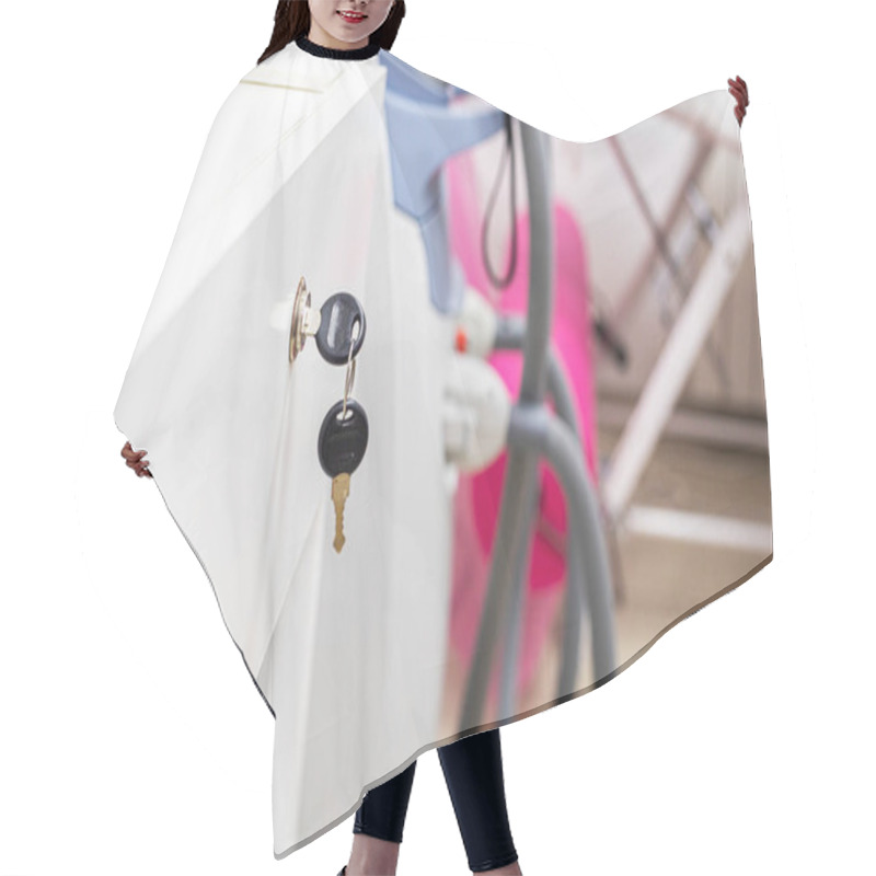 Personality  Key To The Cabinet With Documents In The Medical Office Hair Cutting Cape