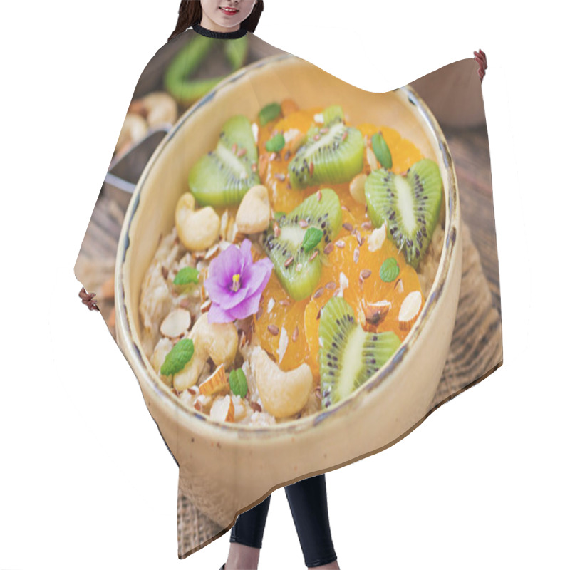 Personality  Tasty And Healthy Oatmeal Porridge With Fruits And Nuts. Healthy Breakfast. Fitness Food. Proper Nutrition. Top View Hair Cutting Cape