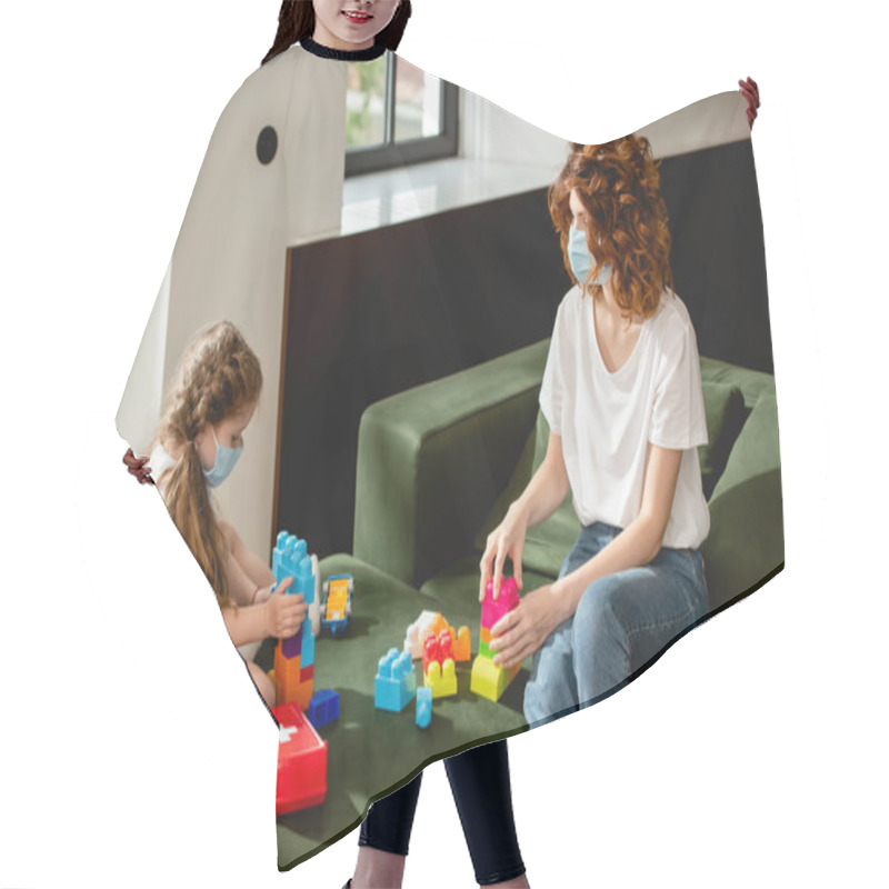 Personality  Redhead Mother And Daughter In Medical Masks Playing Building Blocks  Hair Cutting Cape