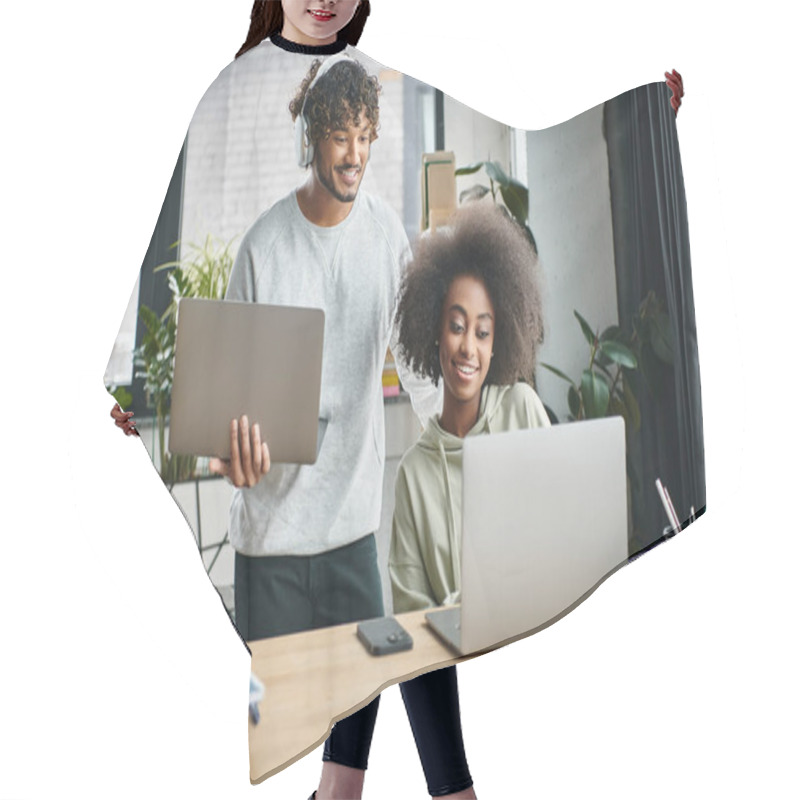 Personality  A Multicultural Man And Woman Focused On Laptops, Collaborating In A Modern Office Coworking Space. Hair Cutting Cape