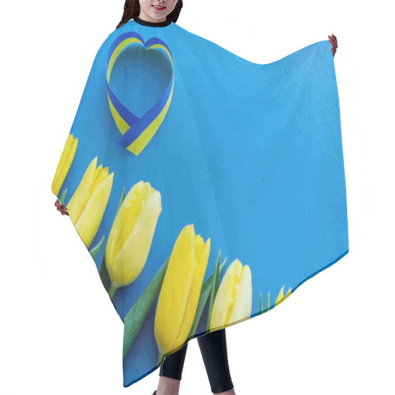 Personality  Top View Of Blue And Yellow Ribbon In Heart Sign Near Tulips On Background Hair Cutting Cape