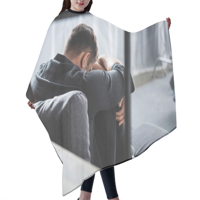 Personality  Back View Of Man With Panic Attack Crying And Hugging Legs In Apartment  Hair Cutting Cape