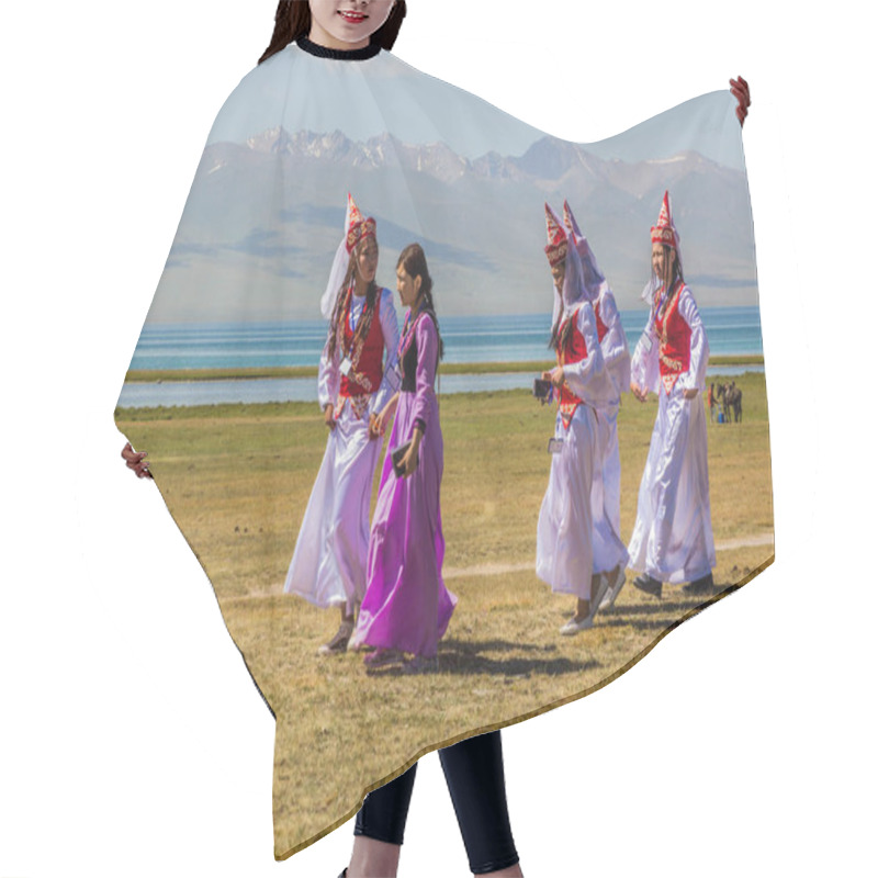 Personality  SONG KOL, KYRGYZSTAN - JULY 25, 2018: Traditional Dress Wearing Girls During The National Horse Games Festival At The Shores Of Son Kol Lake Hair Cutting Cape