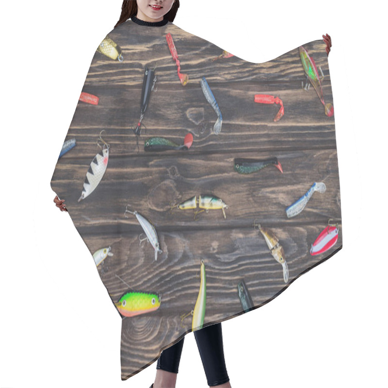 Personality  Elevated View Of Arranged Various Fishing Bait On Wooden Background  Hair Cutting Cape