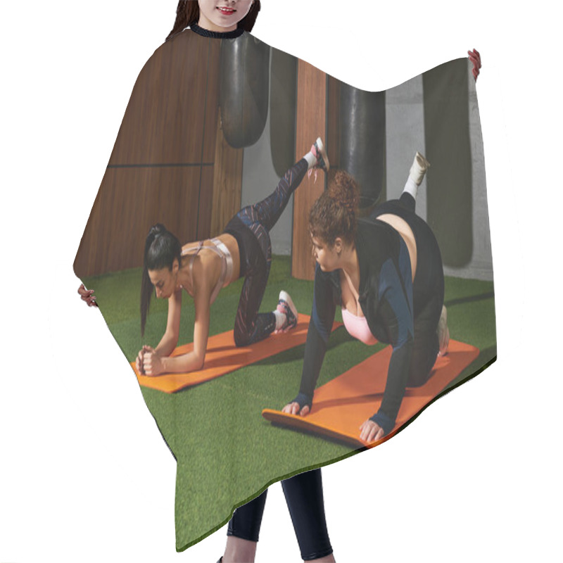 Personality  Two Women Engage In Effective Workout Routines On Exercise Mats In A Modern Gym Setting. Hair Cutting Cape