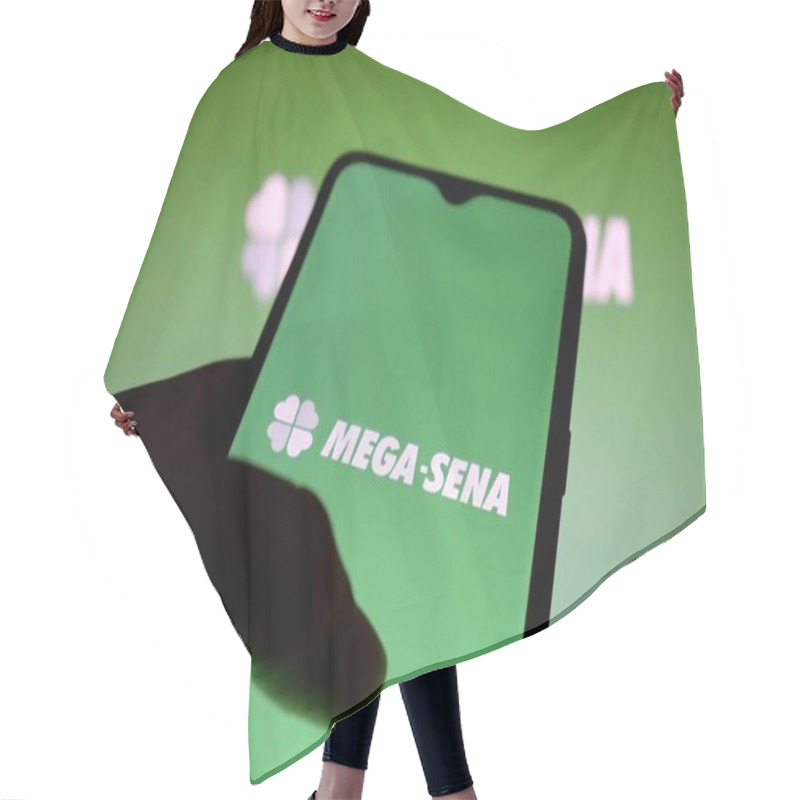 Personality  Bahia, Brazil - July 22, 2021: Mega Sena Lottery Logo On Smartphone Screen. Brazilian Lottery Of Caixa Economica Federal - Loterias Online. Hair Cutting Cape