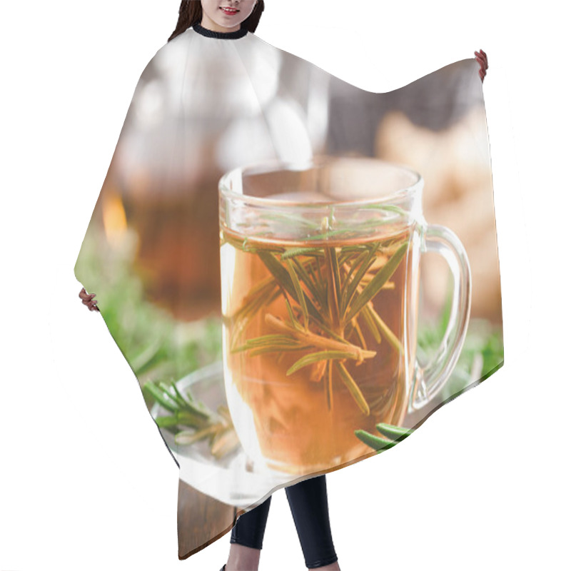 Personality  Rosemary Tea In Glass Tea Cup On Rustic Wooden Table Closeup. Herbal Vitamin Tea.  Hair Cutting Cape