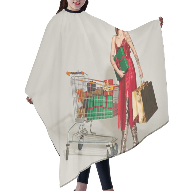 Personality  Joyful Woman In Red Dress Holding Present And Shopping Bags Near Shopping Cart Full Of Wrapped Gifts Hair Cutting Cape