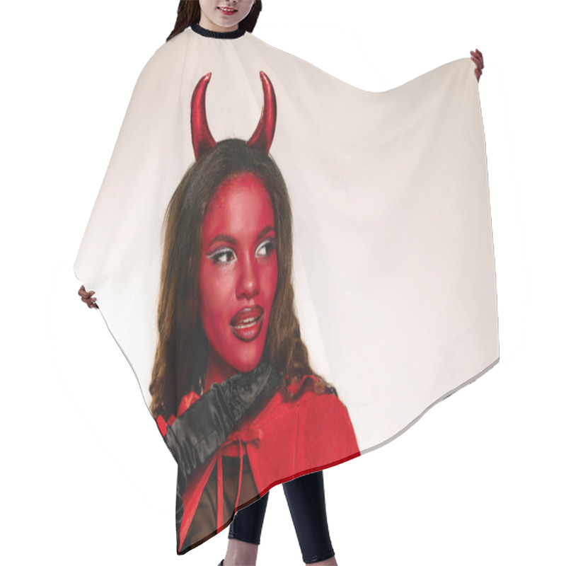 Personality  A Captivating Woman Dressed As A Devil Captures Attention With Her Striking Red Makeup And Costume. Hair Cutting Cape