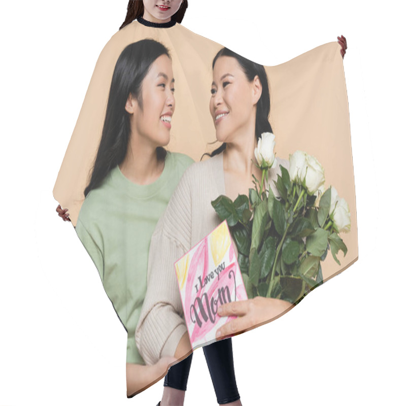 Personality  Cheerful Asian Woman Hugging Mother With Roses And Greeting Card Isolated On Beige Hair Cutting Cape