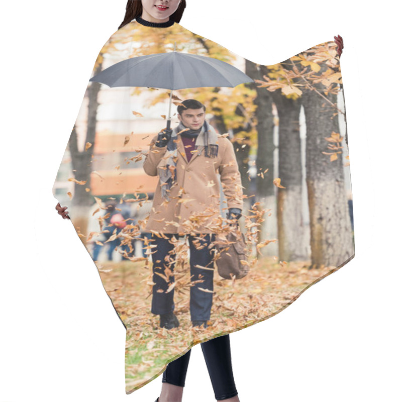 Personality  Handsome Man In Coat With Umbrella Standing On Autumnal Street With Golden Leaves Falling From Above Hair Cutting Cape