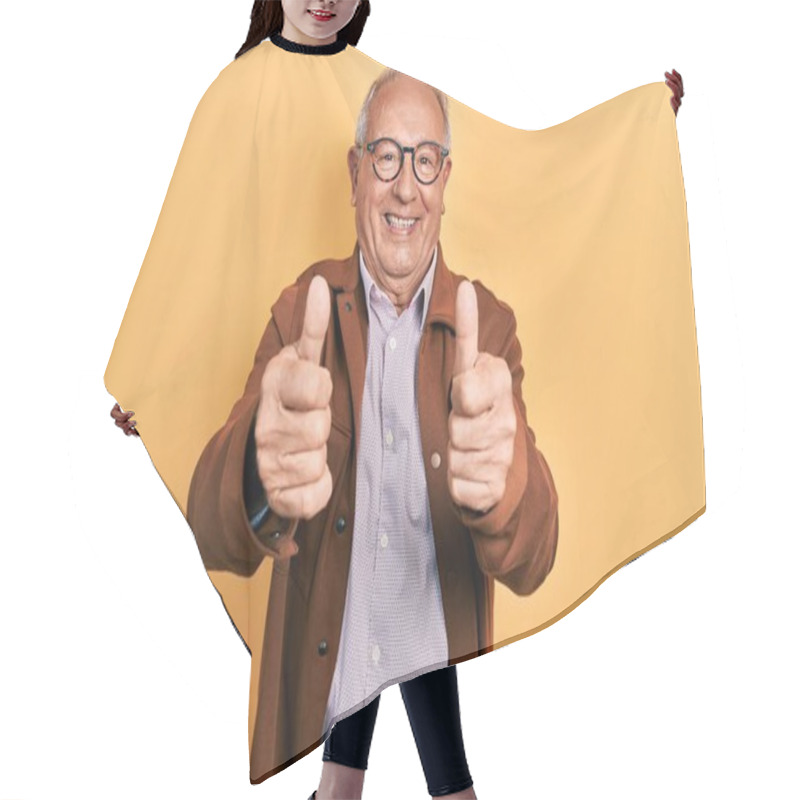 Personality  Senior Man With Grey Hair Wearing Casual Jacket And Glasses Approving Doing Positive Gesture With Hand, Thumbs Up Smiling And Happy For Success. Winner Gesture.  Hair Cutting Cape