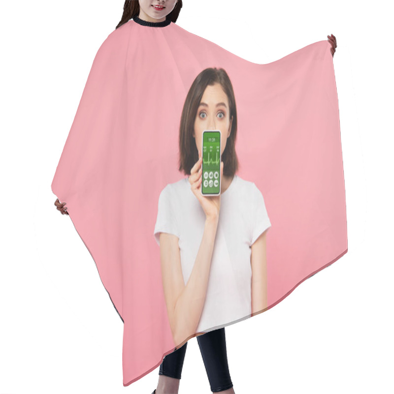 Personality  Surprised Girl Holding Smartphone With Health Tracking App Isolated On Pink Hair Cutting Cape