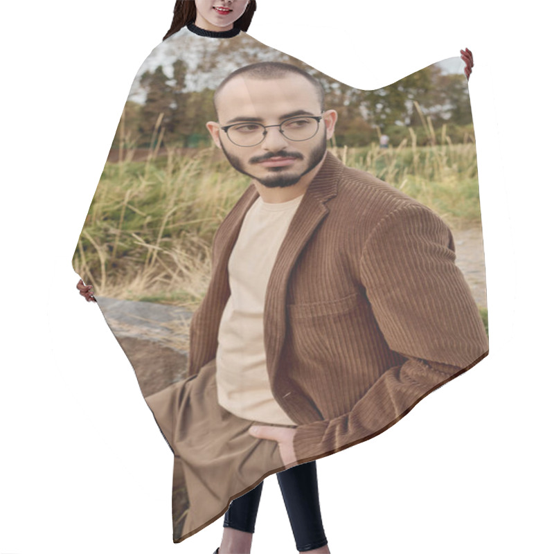 Personality  A Handsome Man In Fashionable Autumn Clothing Stands Proudly In A Tranquil Field Surrounded By Nature. Hair Cutting Cape