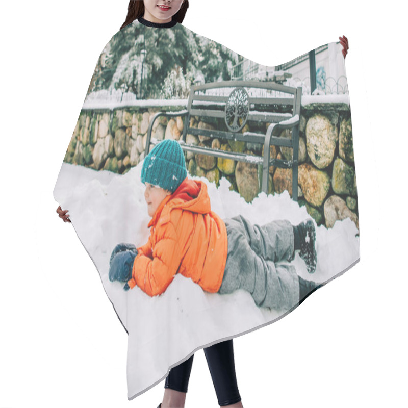 Personality  Child Lying In Snow Near Stone Wall Hair Cutting Cape