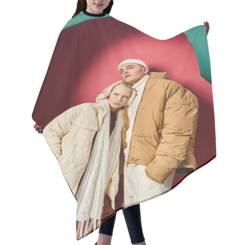 Personality  Young Romantic Couple In Winter Outfits Standing Together Near Torn Turquoise And Red Background Hair Cutting Cape