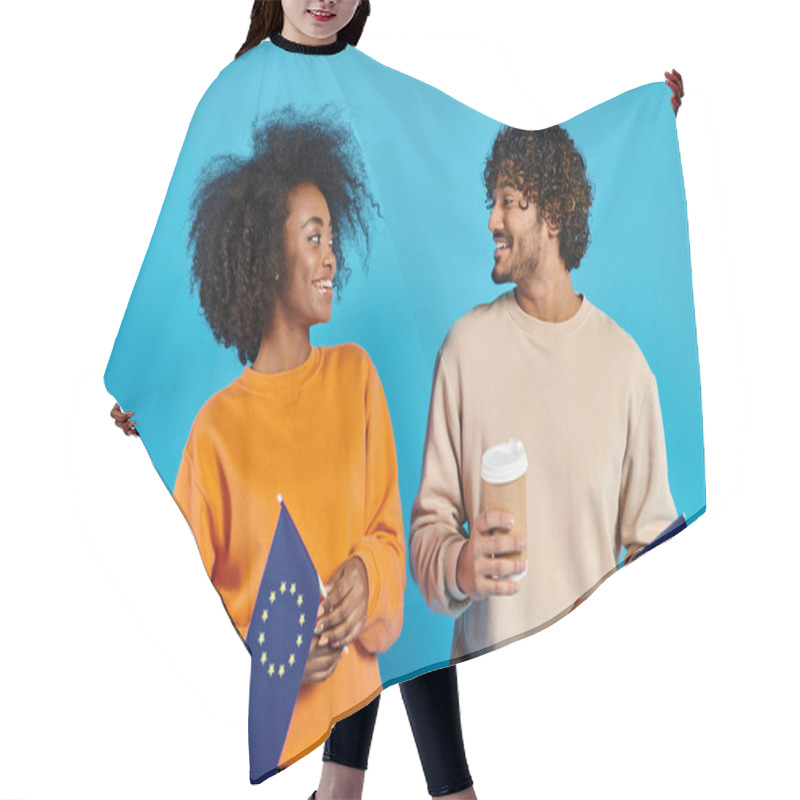 Personality  An Interracial Couple Of Students Standing Side By Side In Casual Attire With EU Flags Against A Blue Backdrop In A Studio. Hair Cutting Cape