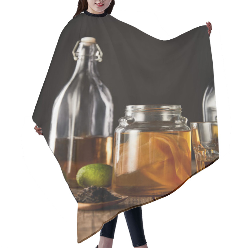 Personality  Glass Jar With Kombucha Near Lime, Spice And Bottle On Wooden Table Isolated On Black Hair Cutting Cape