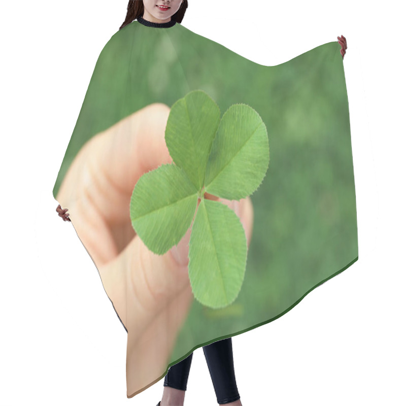 Personality  Woman Holding Four-leaf Clover Outdoors, Closeup Hair Cutting Cape