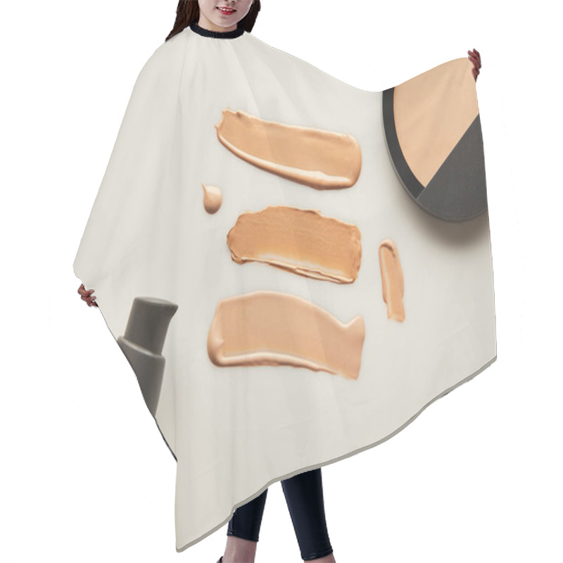 Personality  Top View Of Dispenser, Tone Cream Brushstrokes With Face Powder On Grey Background Hair Cutting Cape