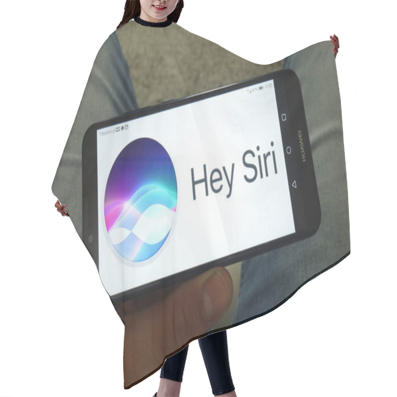 Personality  KONSKIE, POLAND - June 29, 2019: Siri Virtual Assistant Logo On Mobile Phone Hair Cutting Cape