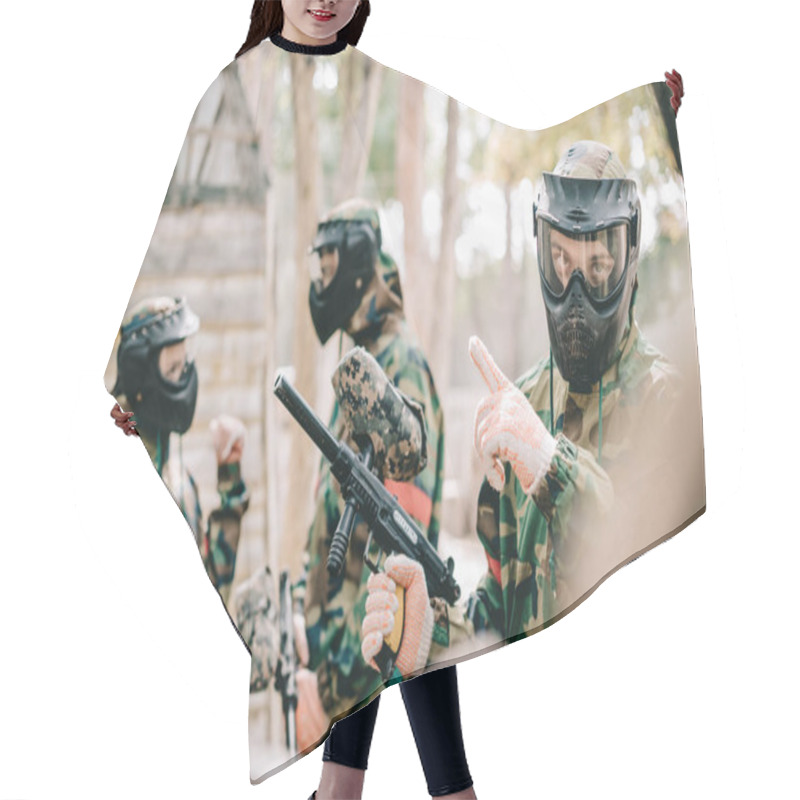 Personality  Male Paintball Player In Goggle Mask With Marker Gun Pointing By Finger To His Team Outdoors  Hair Cutting Cape