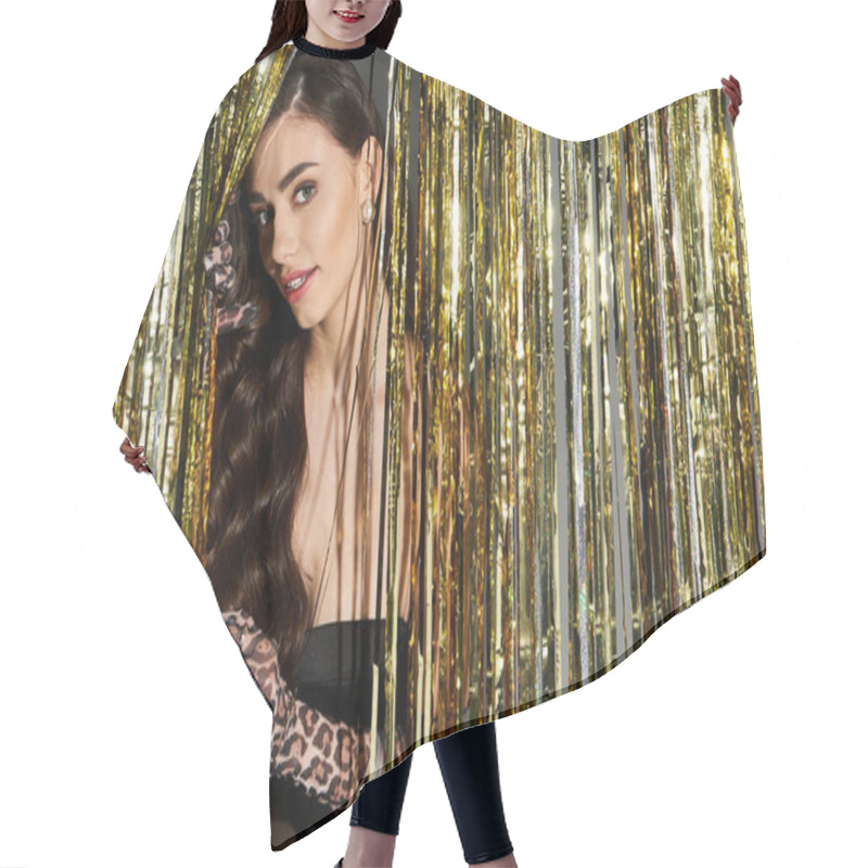 Personality  Stylish Young Woman With Elegant Gloves Playfully Peeks Through Golden Streamers At An Event. Hair Cutting Cape