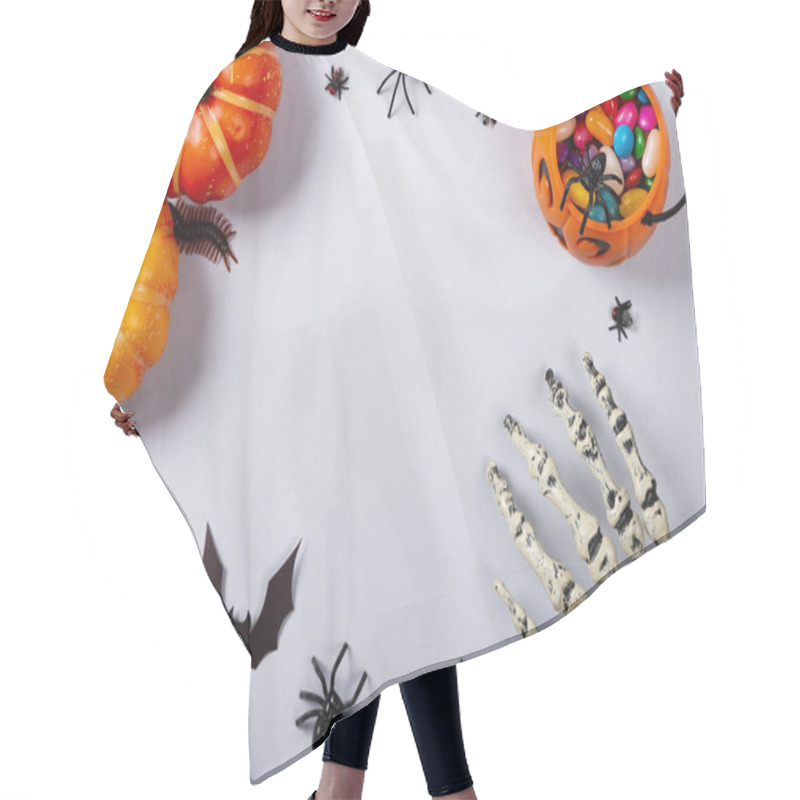 Personality  Halloween And Decoration Concept, Pumpkins, Bats, Skeleton Arm And Candies On Gray Background. Hair Cutting Cape