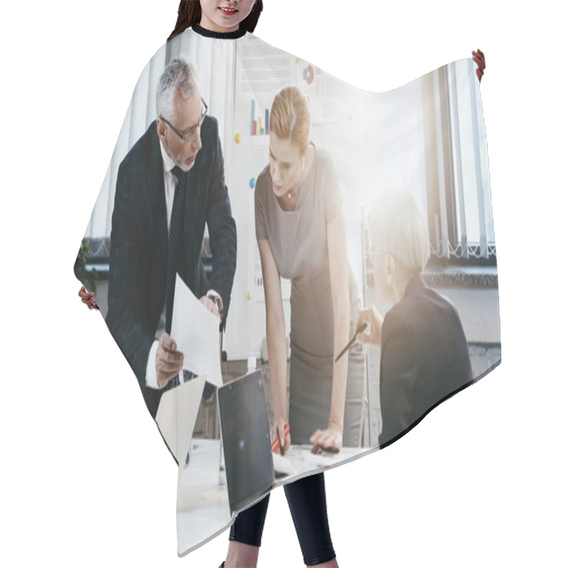 Personality  Businessman Holding Document Near Businesswomen With Devices And Flip Chart In Office  Hair Cutting Cape